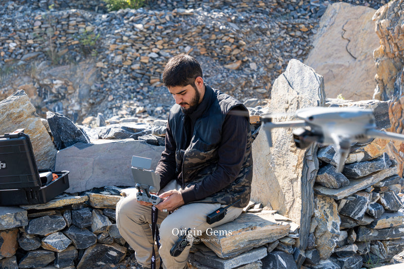 Operating drone on top of the Pink topaz gemstone mine in Katlang ghundao hill Pakistan